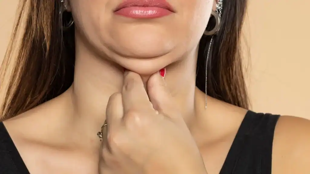 An image of a woman with double chin, sad, worried : Non Surgical Double Chin Removal Treatment in Brentwood, UK