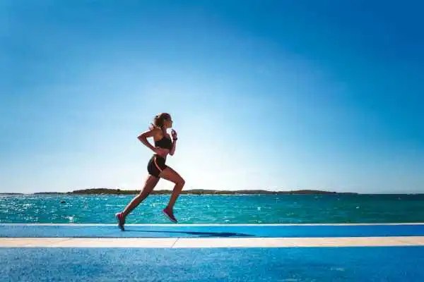 Woman running showing strong leg muscle Brentwood